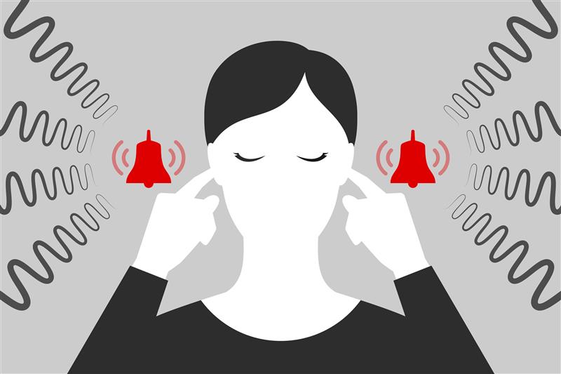 Illustration of a person with fingers in their ears, eyes closed, surrounded by sound waves and red ringing bell icons, representing loud noise or tinnitus.